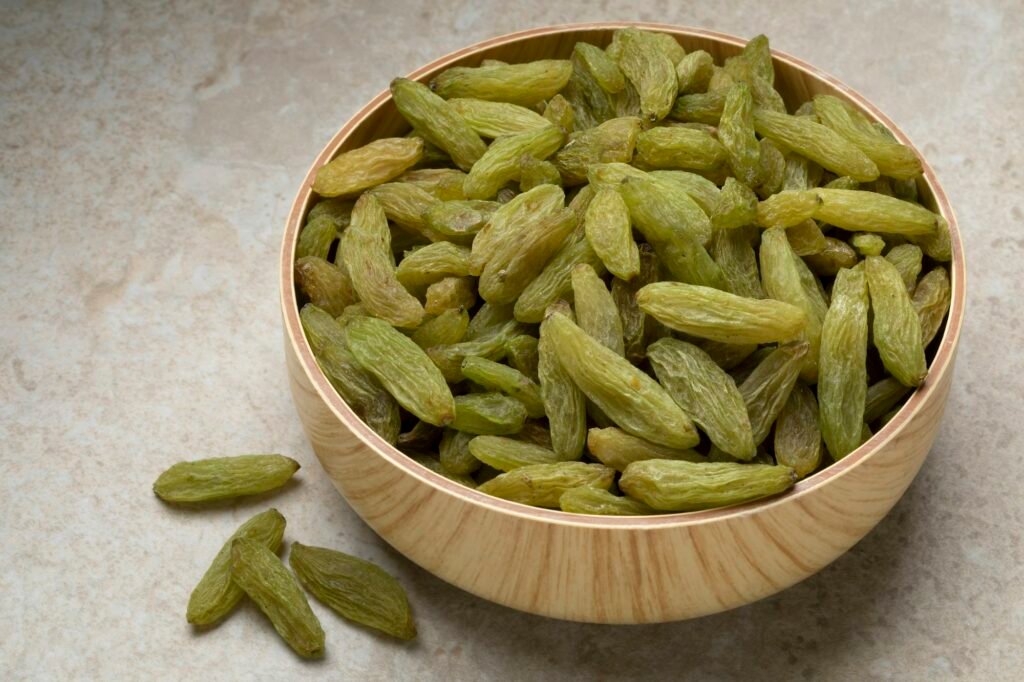 Bowl with green Afghans raisins close up